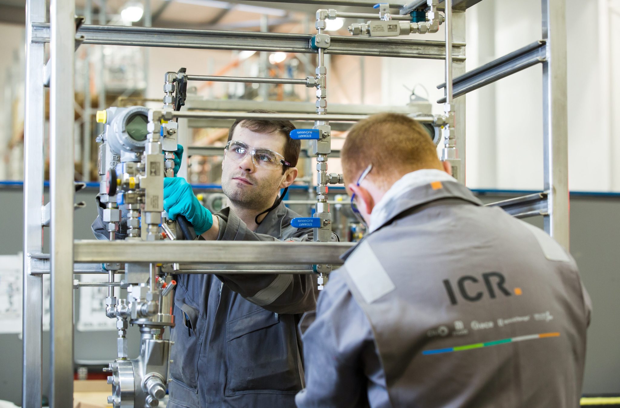 Technicians working on pump skid