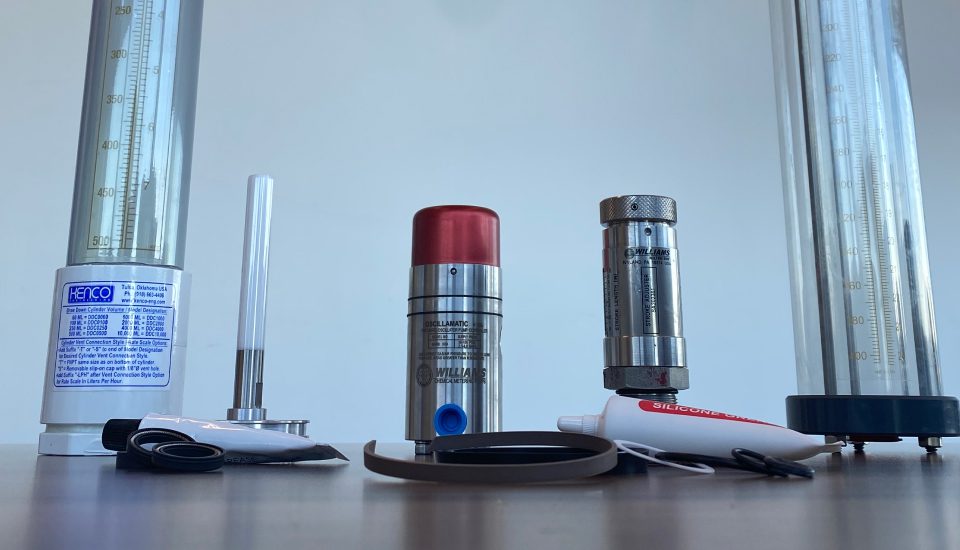 Chemical injection pumps laid out on desk