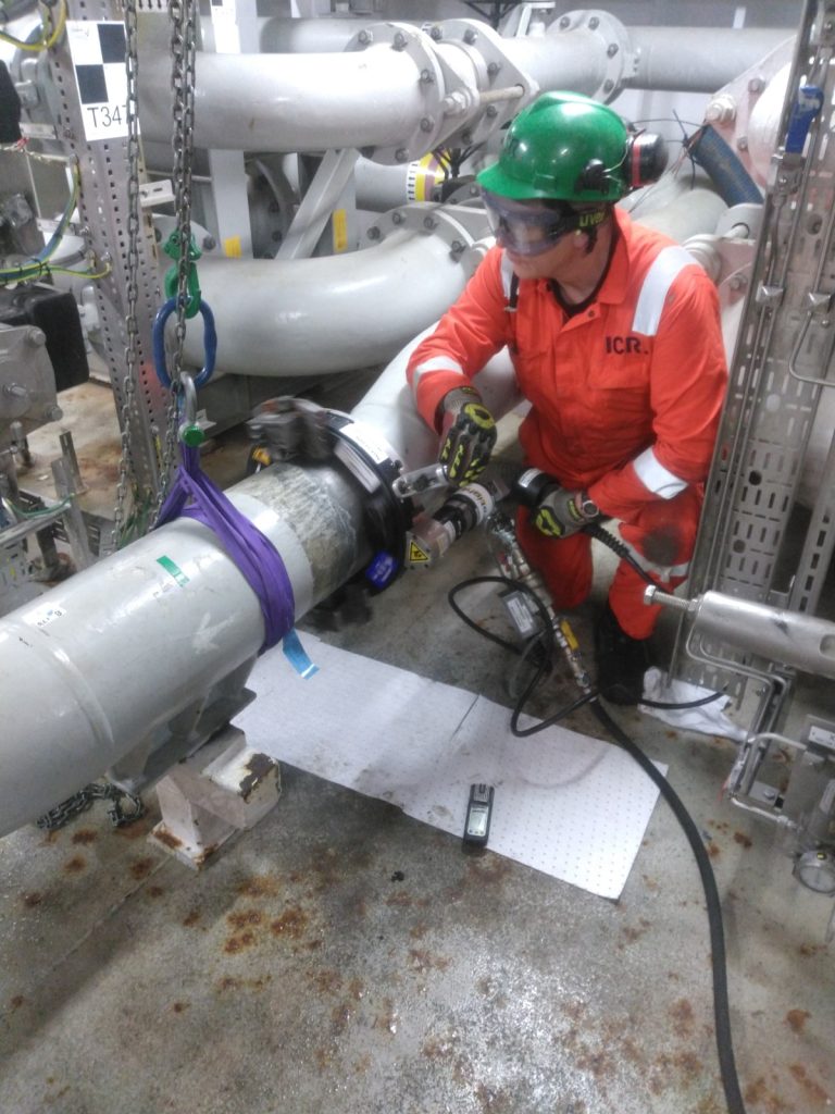 Cutting the pipe using orbital cutting equipment.